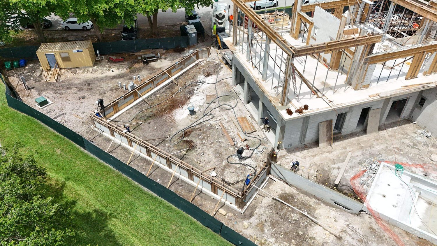 Aerial view of a concrete and block structural shell under construction