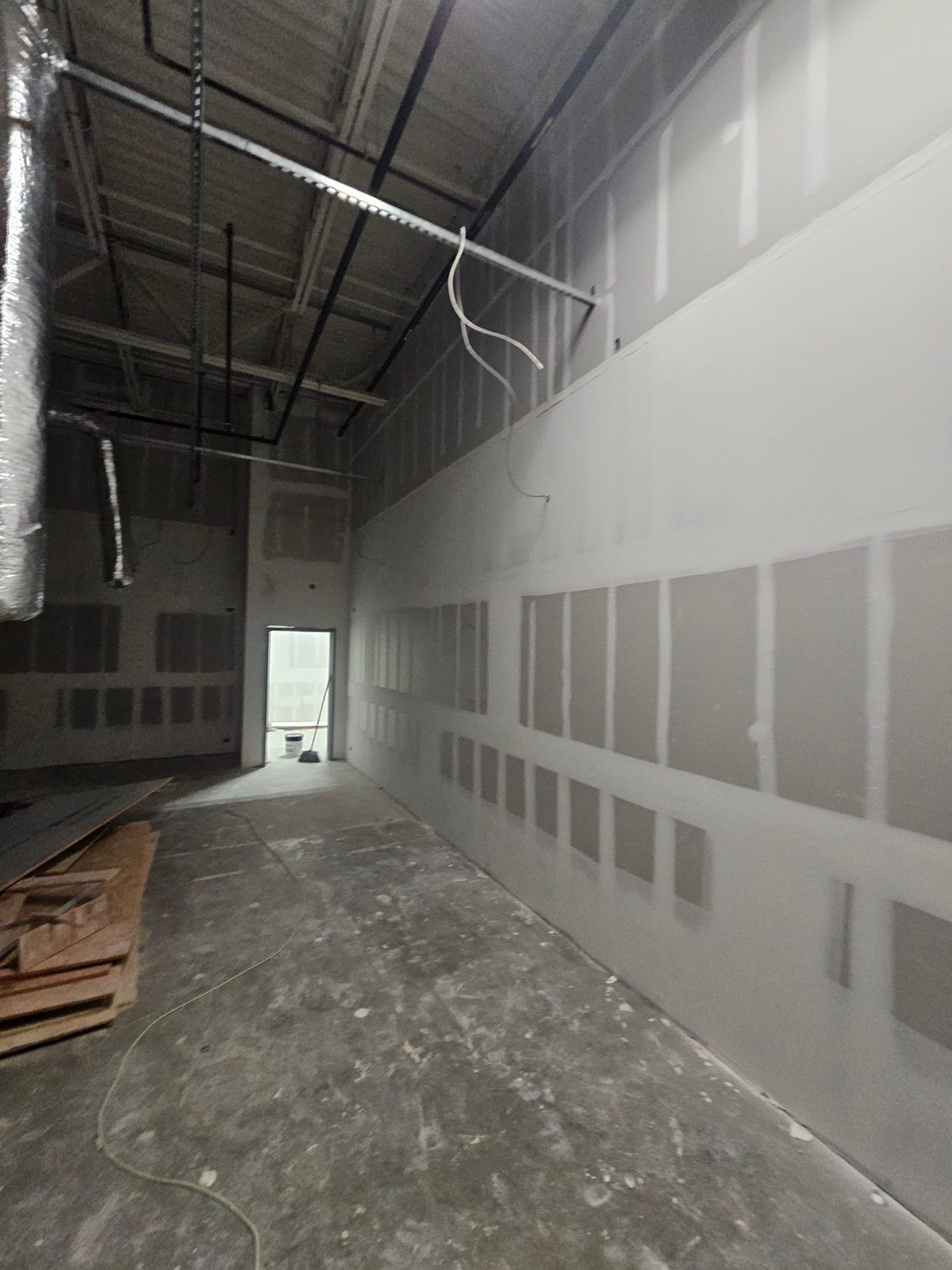 Drywall walls in an open commercial interior space