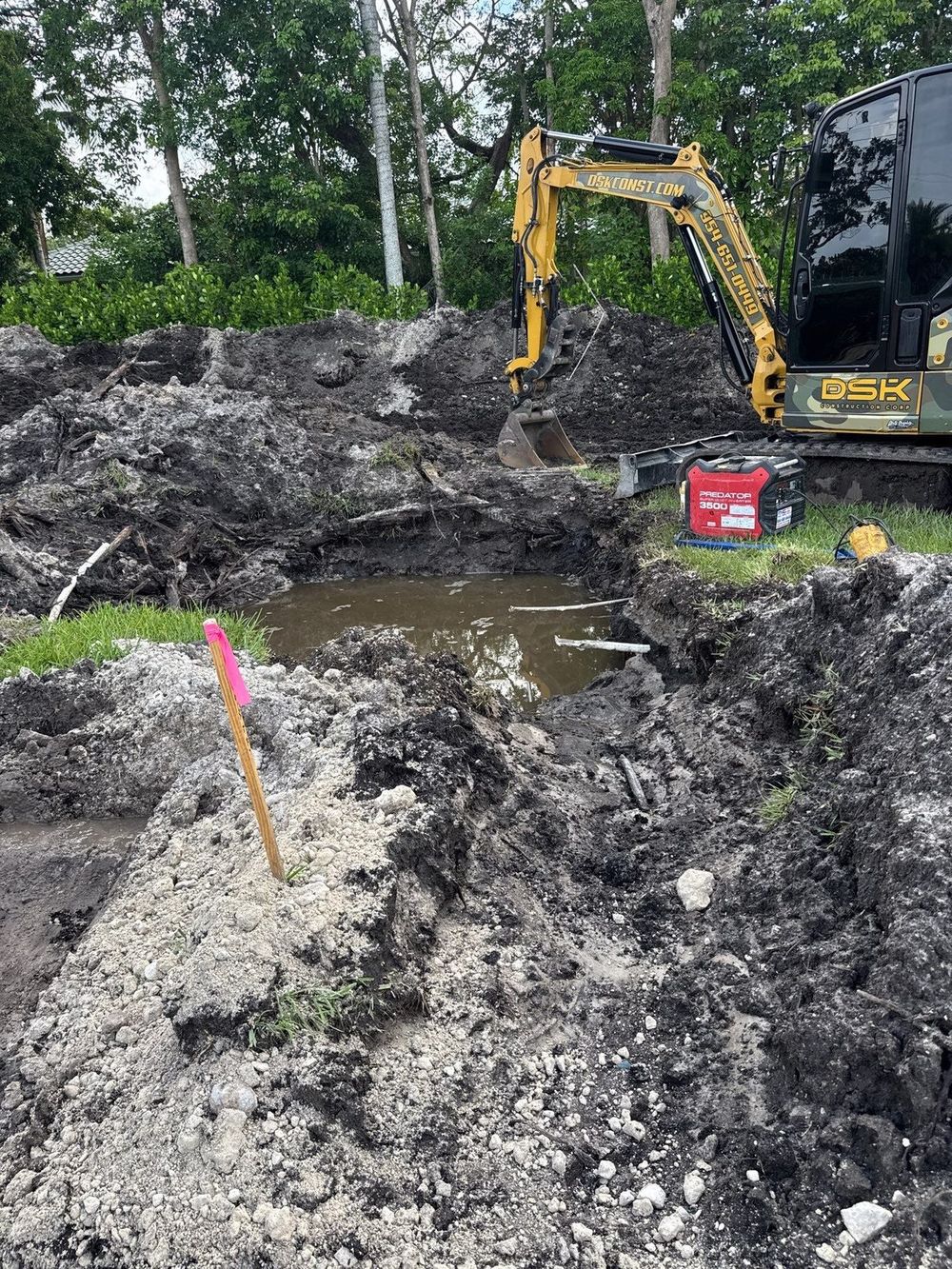 Excavation and earthwork in progress on a residential site