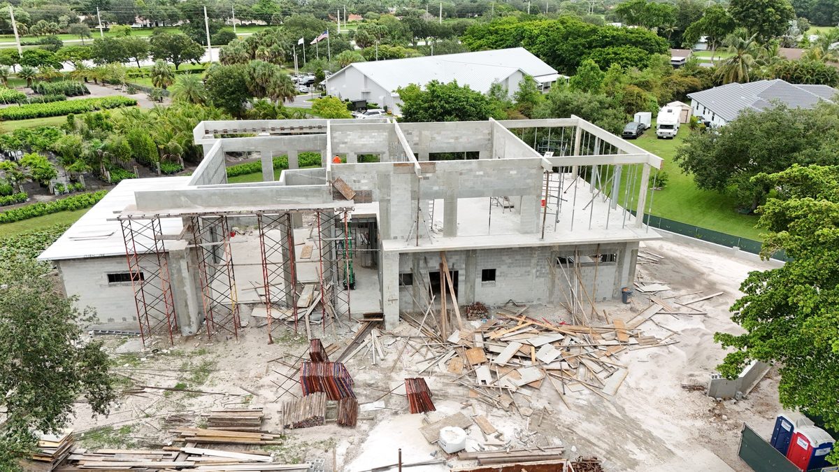 Aerial view of a concrete block home shell under construction
