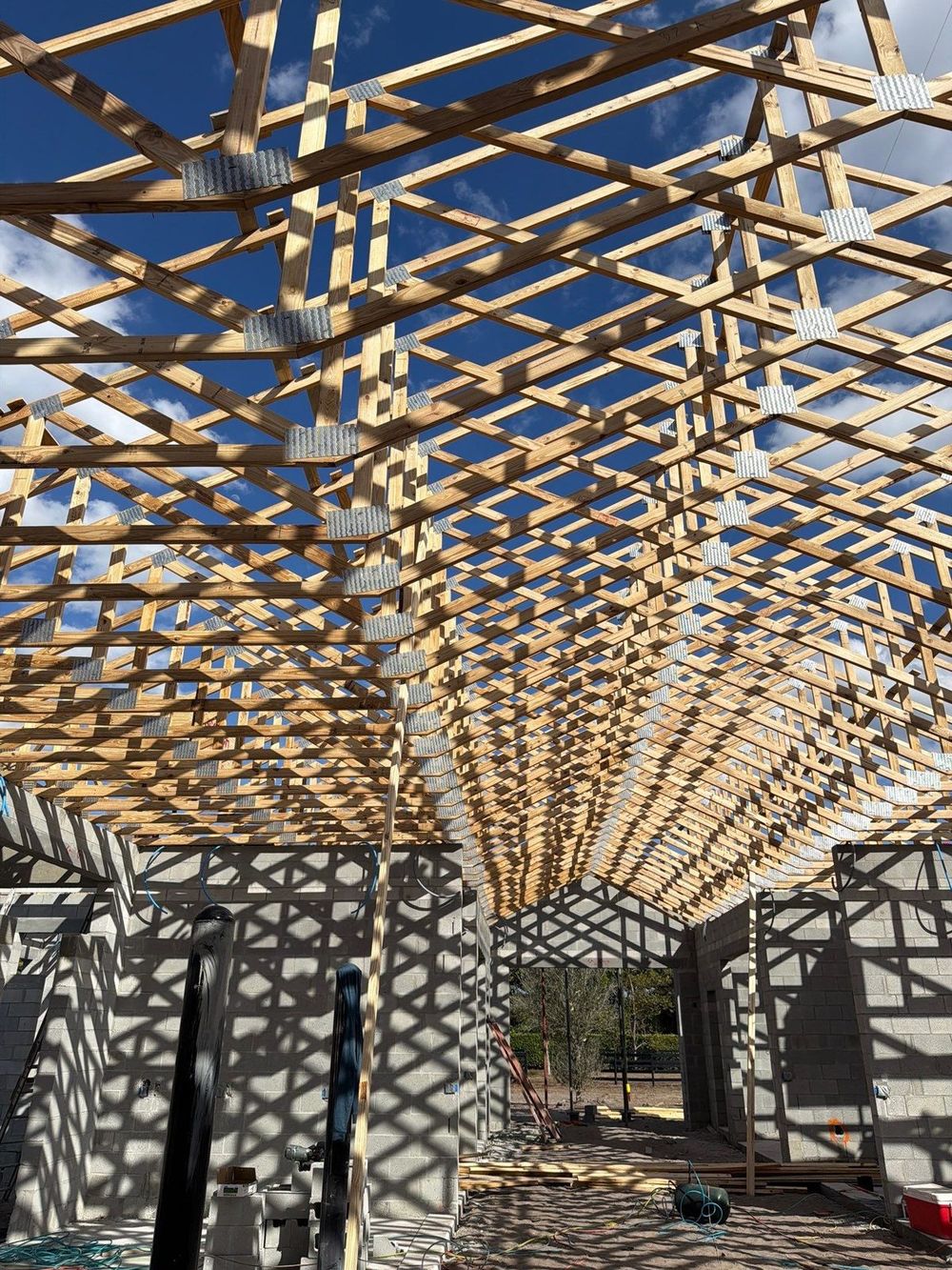 Wood roof trusses framed over a residential structure